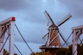 De Zwaan windmill in Holland Michigan framed by the bridge on a cloudy day Royalty Free Stock Photo