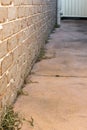 Dead dry grass three weeks after weed killer herbicide spraying to control unwanted plants and grass on a backyard. House building Royalty Free Stock Photo