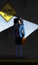 A dead end sign and a business woman with her briefcase are seen together in a shaft of light in an urban setting Royalty Free Stock Photo