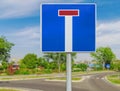 Dead end street traffic sign on road background Royalty Free Stock Photo