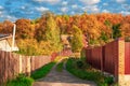 Dead-end village autumn street. Rural farmstead Royalty Free Stock Photo