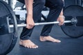 Dead lift with bare hand and feet. Work out in the gym with heavy weight equipment. Ready to deadlift Royalty Free Stock Photo