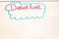 Dead line wording written on white board in the office