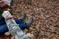 Dead man covered with a tree. the tree turned upside down and injured itself, falling while walking on a hiker, a forest worker. l Royalty Free Stock Photo