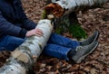 Dead man covered with a tree. the tree turned upside down and injured itself, falling while walking on a hiker, a forest worker. l Royalty Free Stock Photo