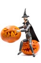 Dead man puppet sit on a pumpkin with a pumpkin in his hands