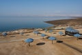 Dead Sea Beach with Parasol Umbrellas in Jordan Royalty Free Stock Photo