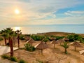 Dead Sea Beach Vacation Resort with Umbrellas in Jordan Royalty Free Stock Photo