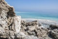 Dead Sea and black dirt Royalty Free Stock Photo