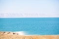 Dead sea, Jordan. Beautiful beach with salt deposits, view of Israel Royalty Free Stock Photo