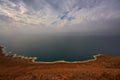 Dead sea, landscape from Jordan view. Coast, water with blue sky with clouds. salt lake bordered by Jordan to the east and the