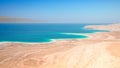 Dead Sea salt lake surface shore and beach