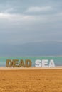 Dead Sea statue with the Dead Sea and clouds on a Winter`s day, Great photo opportunity for tou