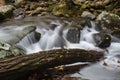 Deadfall log across a portion of a creek in the Great Smoky Mountains in fall