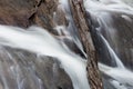 Deadfall log across rocks and rushing river in the Great Smoky Mountains