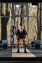 Deadlift attempt. Young man trying to lift heavy barbell Royalty Free Stock Photo