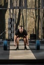 Deadlift attempt. Young man trying to lift heavy barbell Royalty Free Stock Photo