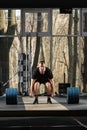 Deadlift attempt. Young man trying to lift heavy barbell Royalty Free Stock Photo