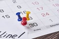 Deadline concept. A paper with Deadline text pinned on monthly calendar Royalty Free Stock Photo