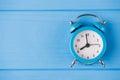 Deadline concept. Top above overhead view close-up photo of blue clock isolated on blue wooden background with copyspace Royalty Free Stock Photo
