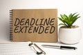 DEADLINE EXTENDED paper notepad on office work place Royalty Free Stock Photo