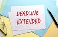 DEADLINE EXTENDED text on paper sheet with chart,color paper and calculator Royalty Free Stock Photo