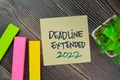 Deadline Extended 2022 write on sticky notes isolated on Wooden Table Royalty Free Stock Photo