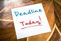 Deadline Sticky Note On Paper For Today Lying On Wooden Table Royalty Free Stock Photo