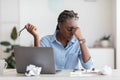 Deadline Stress. Overworked Black Female Entrepreneur Massaging Nosebridge At Workplace In Office Royalty Free Stock Photo