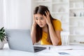 Deadline Stress. Shocked asian woman looking at laptop screen and touching head Royalty Free Stock Photo