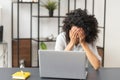 African-American female office worker feeling tired