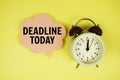 Deadline Today text on speech bubble with alarm clock on yellow background Royalty Free Stock Photo