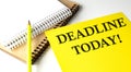 DEADLINE TODAY text written on a yellow paper with notebook Royalty Free Stock Photo