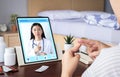 Deaf mute patient use video conference, make online consultation by sign language with doctor on tablet application about illness