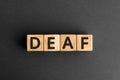 Deaf - word from wooden blocks with letters