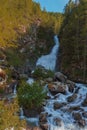 A deafening waterrfall falling from glaciers in the National Par Royalty Free Stock Photo