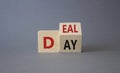 Deal of the Day symbol. Turned cube with words Deal of the Day. Beautiful grey background. Business and Deal of the Day concept.