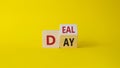 Deal of the Day symbol. Turned cube with words Deal of the Day. Beautiful yellow background. Business and Deal of the Day concept
