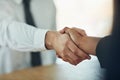 And so the deal is done. a businessman and businesswoman shaking hands in a modern office. Royalty Free Stock Photo