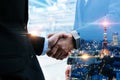 Deal. double exposure image of investor business man handshake with partner Royalty Free Stock Photo