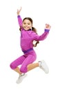 Deal with long hair while exercising. Girl cute kid with long ponytails sportive costume jump isolated on white. Working Royalty Free Stock Photo