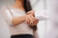 The deal is sealed. Low angle shot of two colleagues shaking hands. Royalty Free Stock Photo