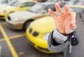 Dealer hand with a car key. Royalty Free Stock Photo