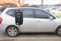 Dealer hand with a car key. Royalty Free Stock Photo