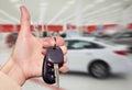 Dealer hand with a car key. Royalty Free Stock Photo