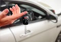 Dealer hand with a car key. Royalty Free Stock Photo