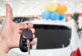 Dealer hand with a car key. Royalty Free Stock Photo