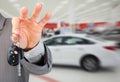 Dealer hand with a car key. Royalty Free Stock Photo