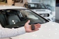 Dealer is holding the keys to a new car in his hand. Modern and prestigious vehicles Royalty Free Stock Photo