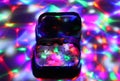 A box filled with ecstasy under disco lights. Royalty Free Stock Photo